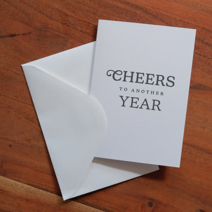 Cheers to another Year Greeting Card