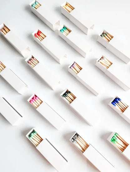 White Matchbox with Colorful Matchsticks